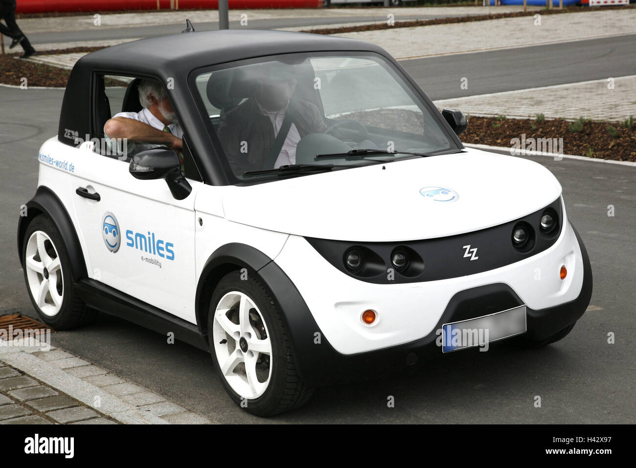 Electric car, driver, front seat passenger, Germany, Bavaria, Lower Bavaria, Teisnach, Soleg, showing, exhibit, test run, journey, car, vehicle, energy, energy source, solar power, current, alternatively, alternative energy, solar energy, solar, environme Stock Photo