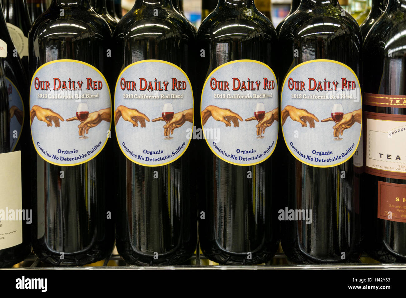 Bottles of Our Daily Red organic 2013 California Red Blend wine.  Label says Contains No Detectable Sulfites. Stock Photo