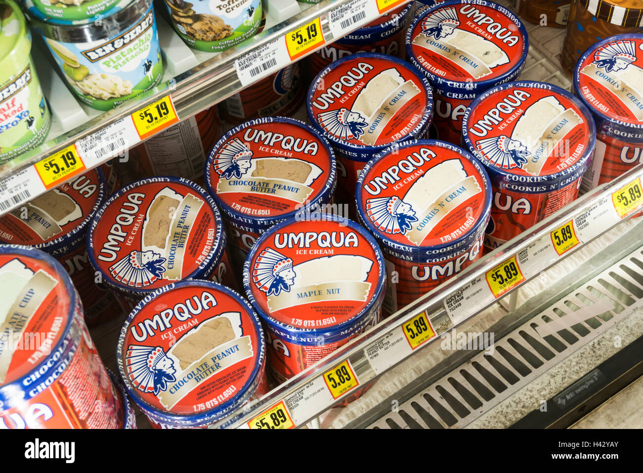 Tubs of Umpqua ice cream from Oregon in an American supermarket cold cabinet. Stock Photo