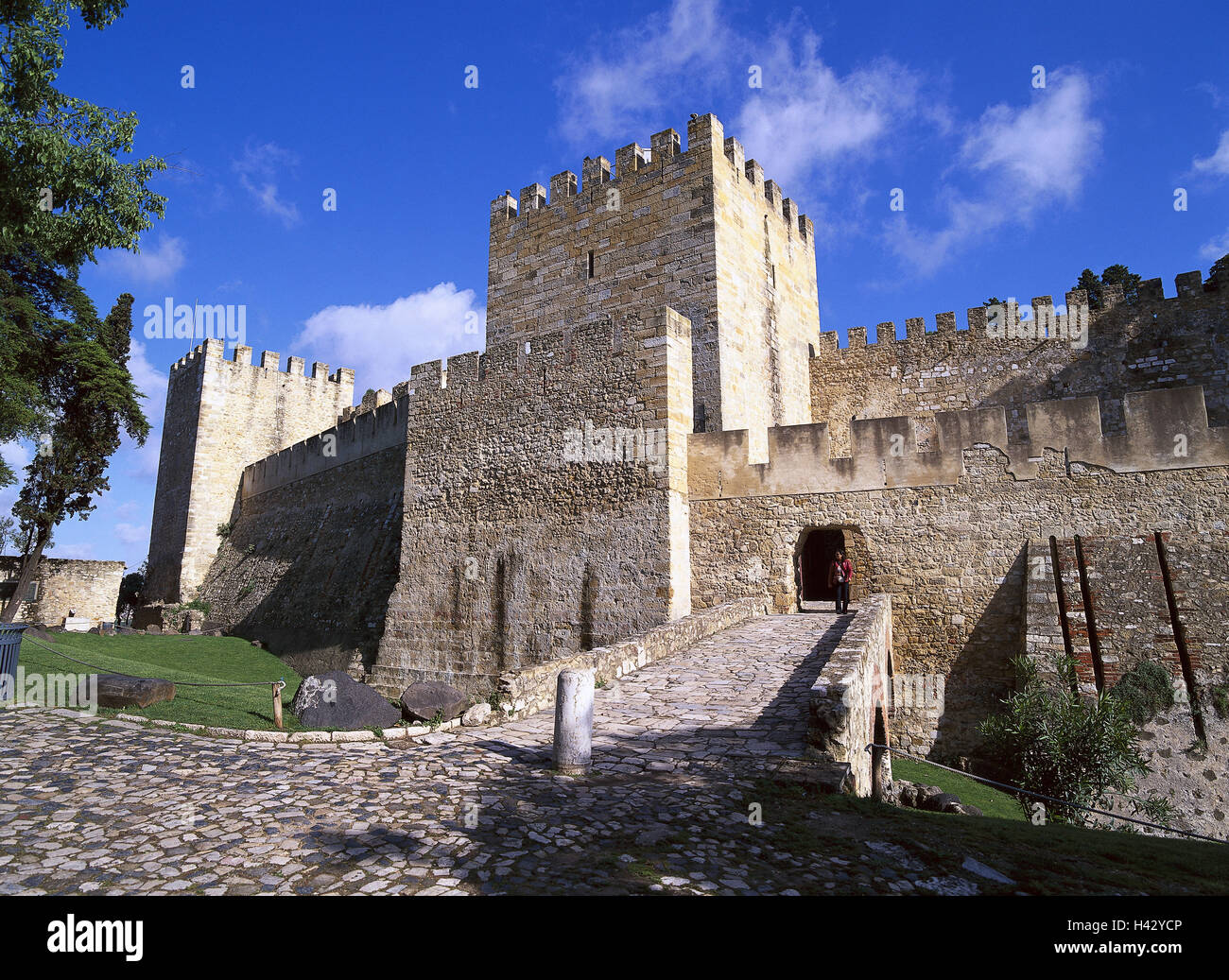 Portugal, Lisbon, Castello Sao Jorge, main entrance, Europe, town, capital, fort, Alkazar, fortress, castle, castle defensive wall, tower, towers, architectural style, structure, passer-by, tourist, tourism, cloudy sky, place of interest, architecture, historically, story Stock Photo