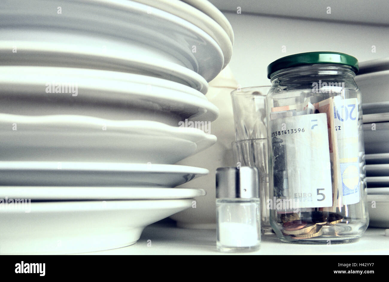 Culinary shelf, plate, glass, screw cap, housekeeping money, detail, cuisine, shelf, cupboard, dishes, dinner set, preserving jar, money, bank notes, banknotes, coins, cash, hides, retention, icon, conception, household, finances, housekeeping, housekeepi Stock Photo