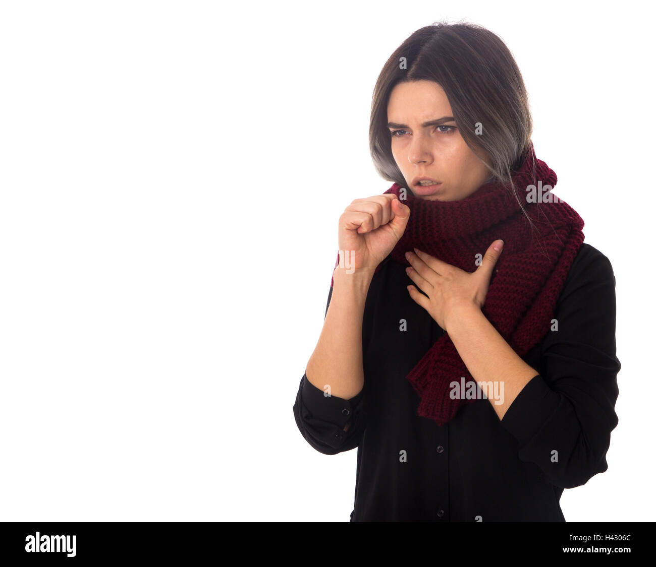 Sick woman with scarf coughing Stock Photo