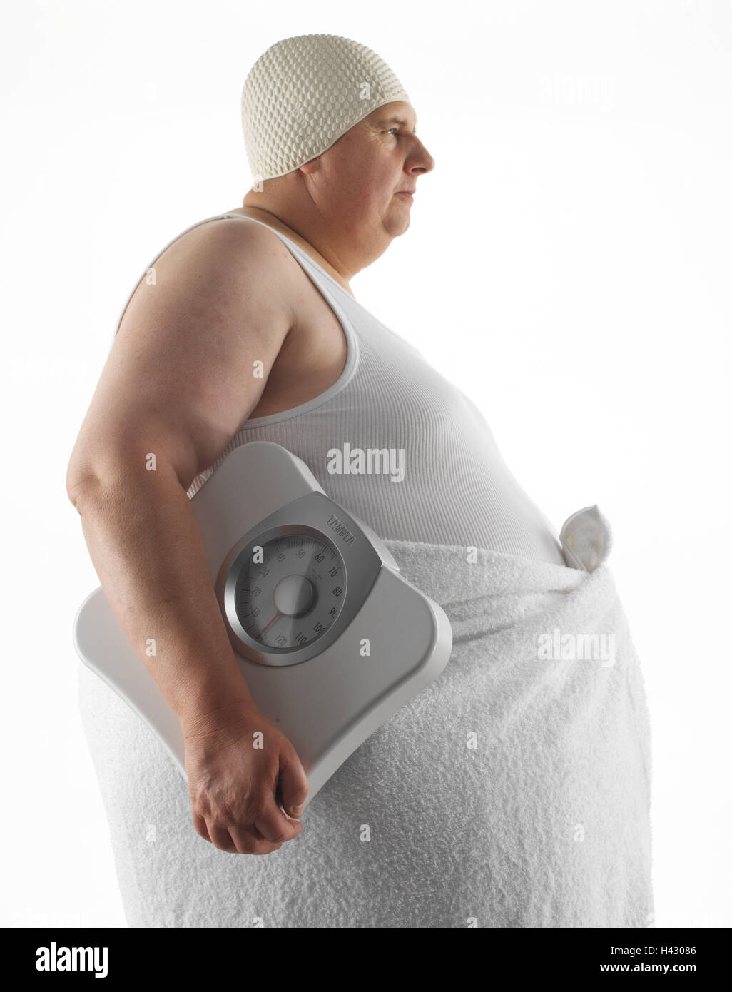 Man, stand overweight, bathing cap, vest, bath towel, body scales, side view, middle old person, thickly, bold, overweight, adiposity, obesity, fatly, obesity, preview, seriously, towel, bathing cap, scales, bathroom scales, carry, body perimetre, weight Stock Photo