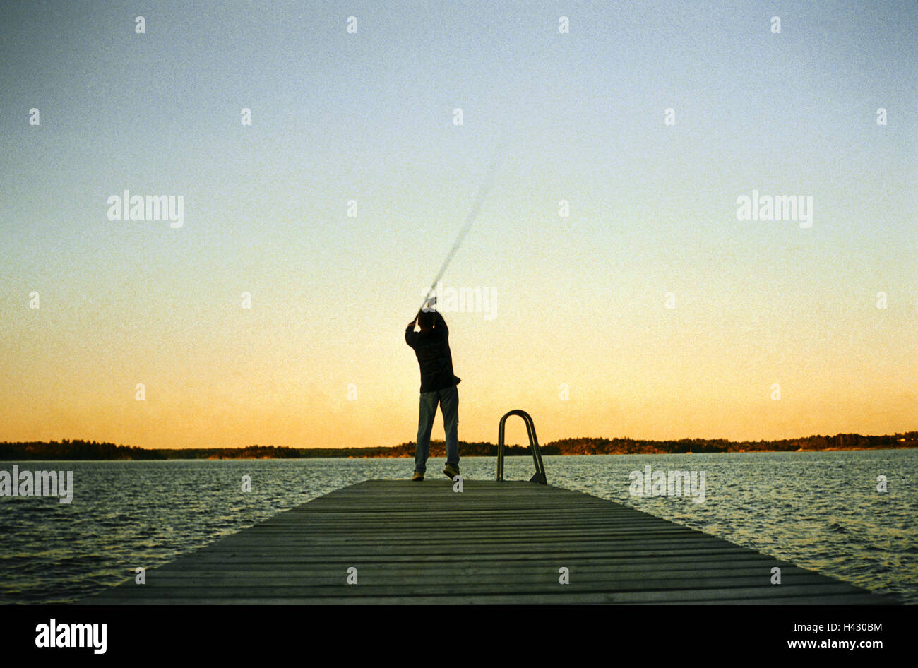 https://c8.alamy.com/comp/H430BM/sea-bridge-man-fishing-rod-casts-move-opinion-dusk-anglers-leisure-H430BM.jpg