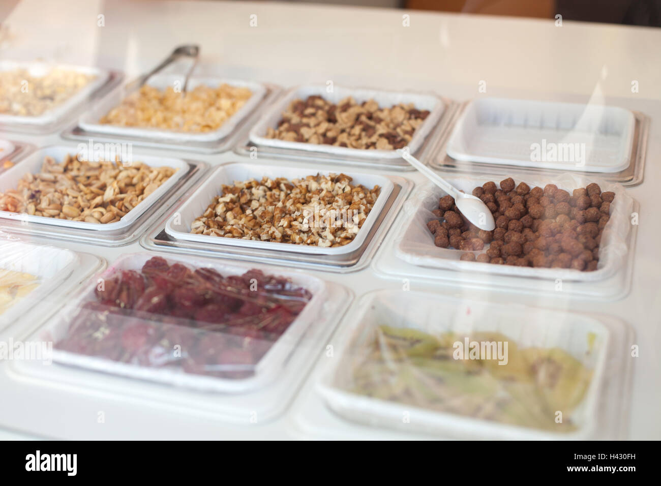 Bowls with different nuts and chocolate balls Stock Photo Alamy