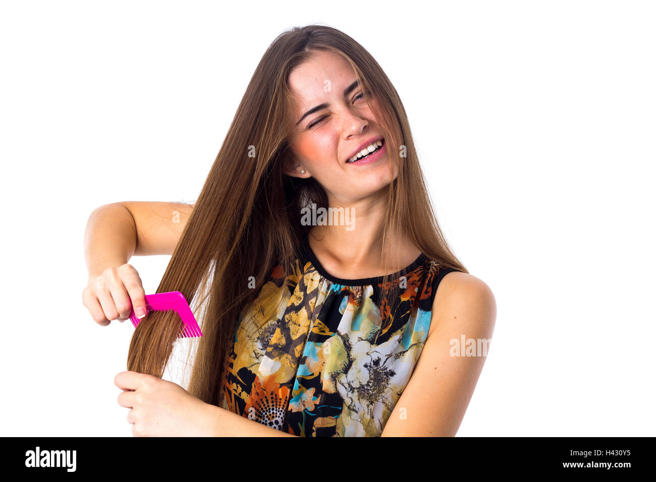 Young woman brushing her long hair Stock Photo Alamy