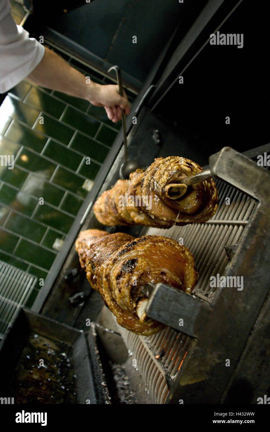 Grill, knuckles pork, man, hand, tennis racket, detail, legs, pig