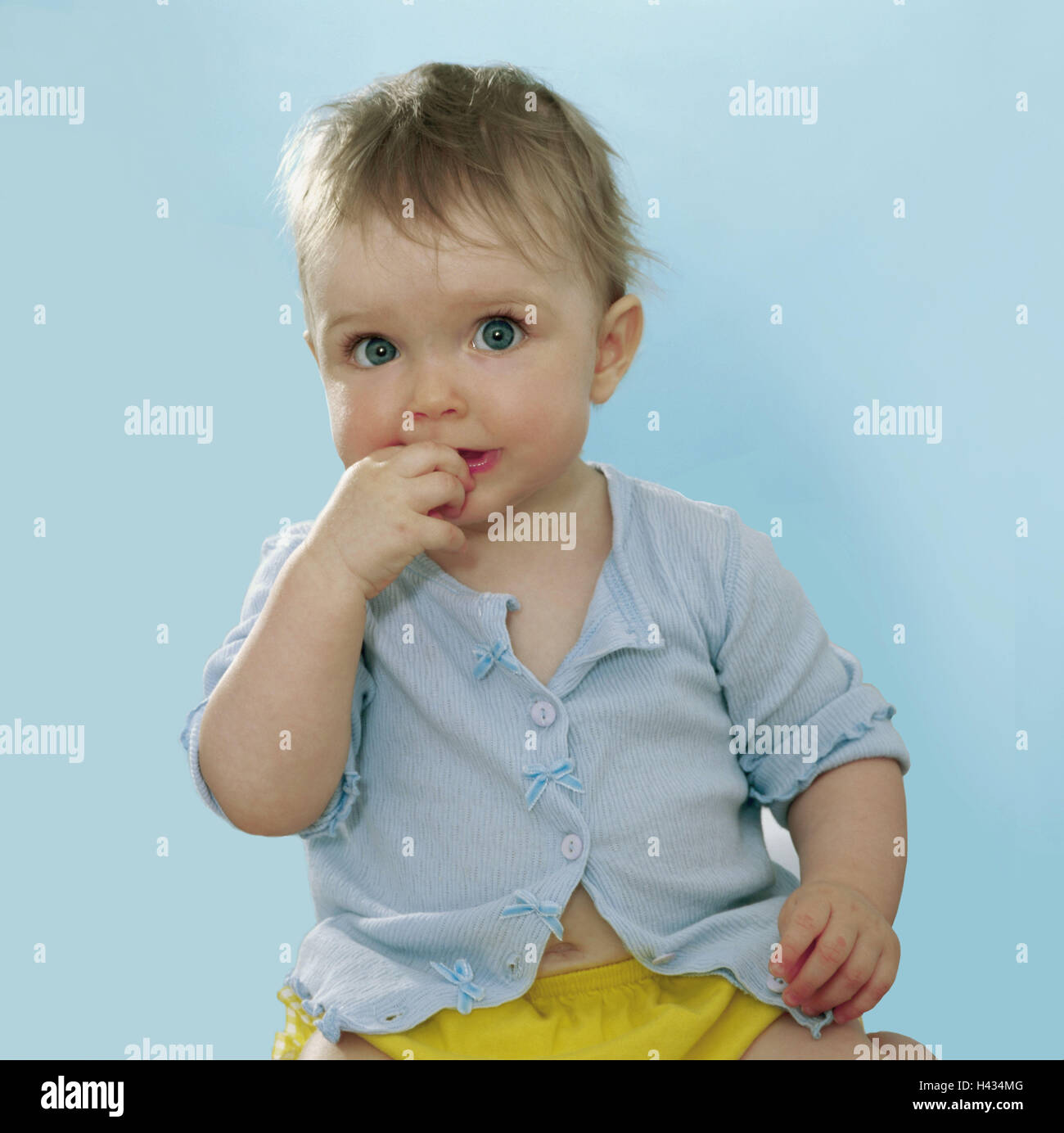 Toddler, girls, hand, mouth, touch, detail, series, people, child, 9 months, top light-blue, gaze camera, eye-color blue, childhood freely, naturalness, interior, Stock Photo