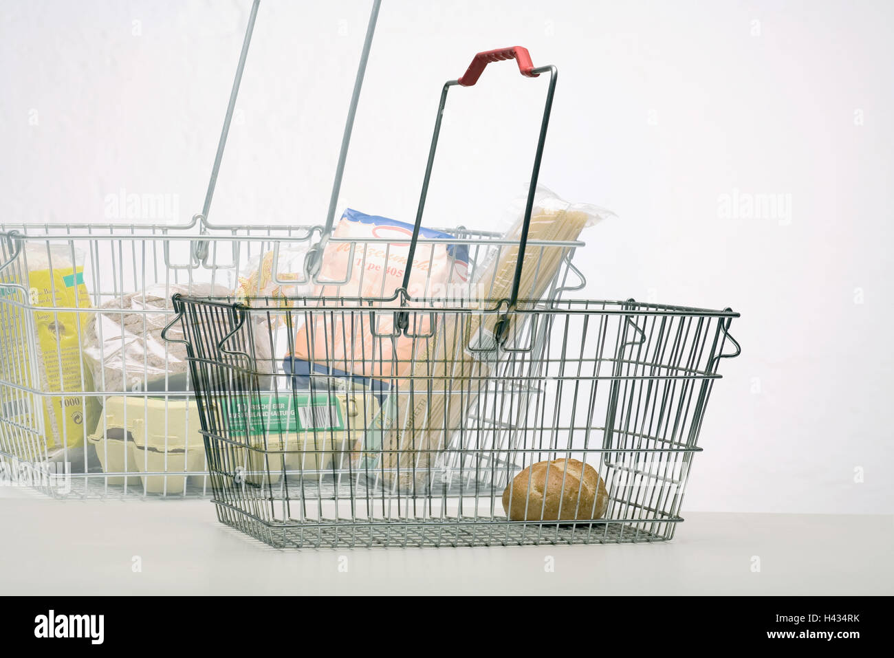 Purchase-baskets, content, quantity, differently, [M], baskets, metal-baskets, metal, food, full, empty, symbol, buying power, buying power-decrease, depreciation, sales tax-increase, tax-increase, value added tax-increase, concept, shopping, storage, tra Stock Photo