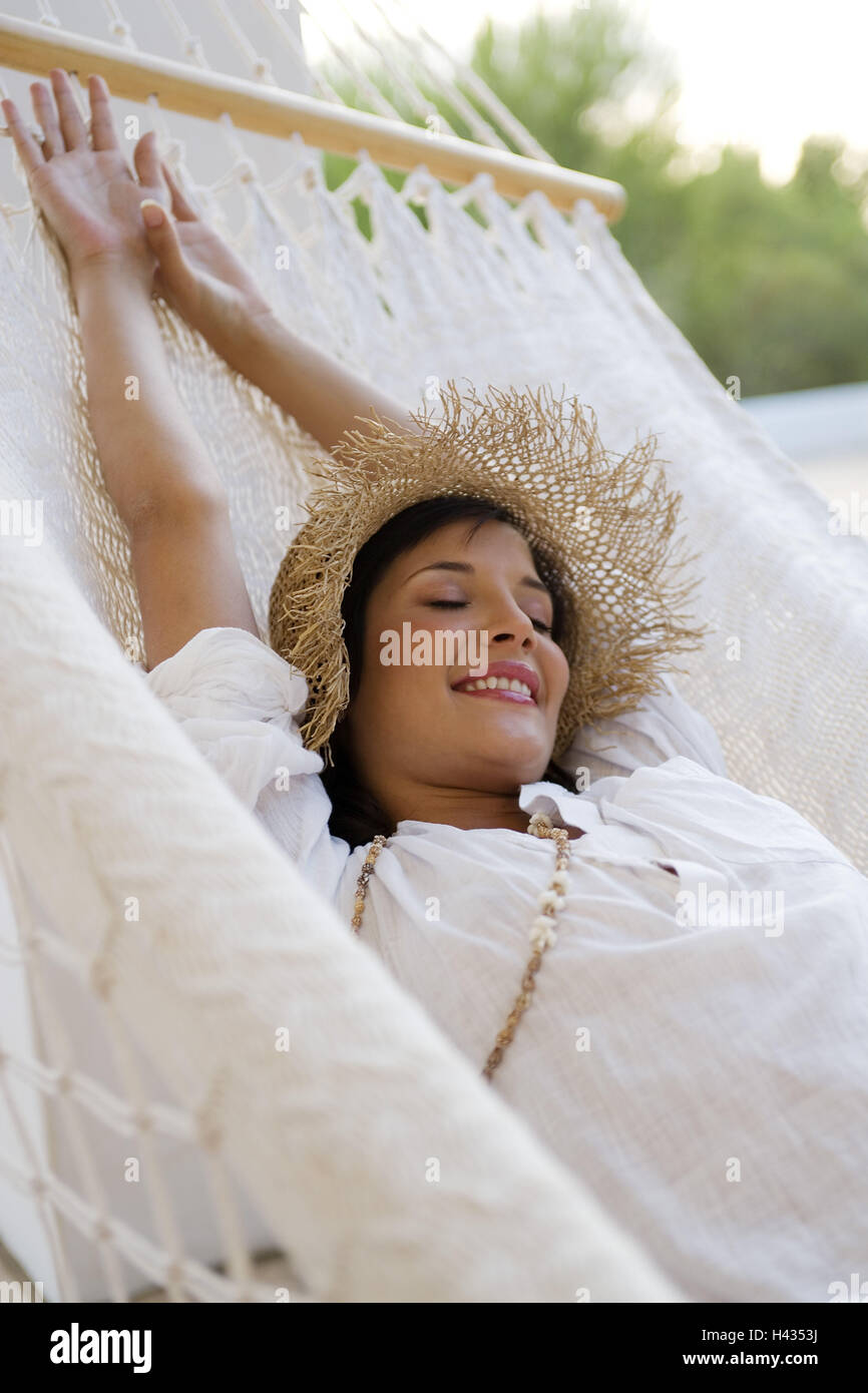 Lying woman, young, straw hat, hammock, happy, relax, Stock Photo