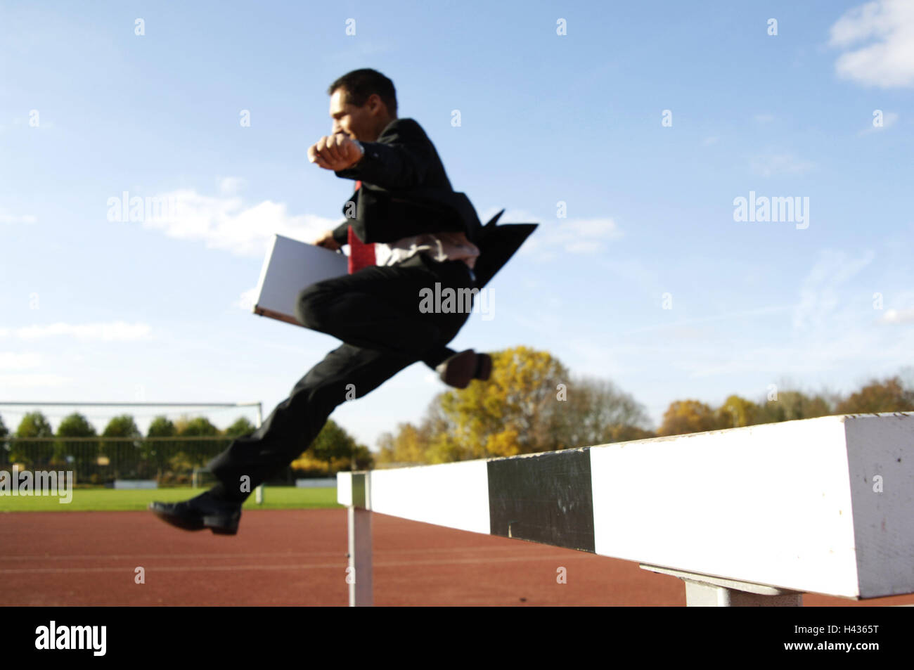 Businessman, Tartanbahn, hurdle, crack, perseverance, motivation, Dynamically, smile, sprint, suit, sport, business, icon, career, occupation, career, success, readiness, motivation, ambition, energy, motion, briefcase, suitcase, Purposefully, capacity, c Stock Photo