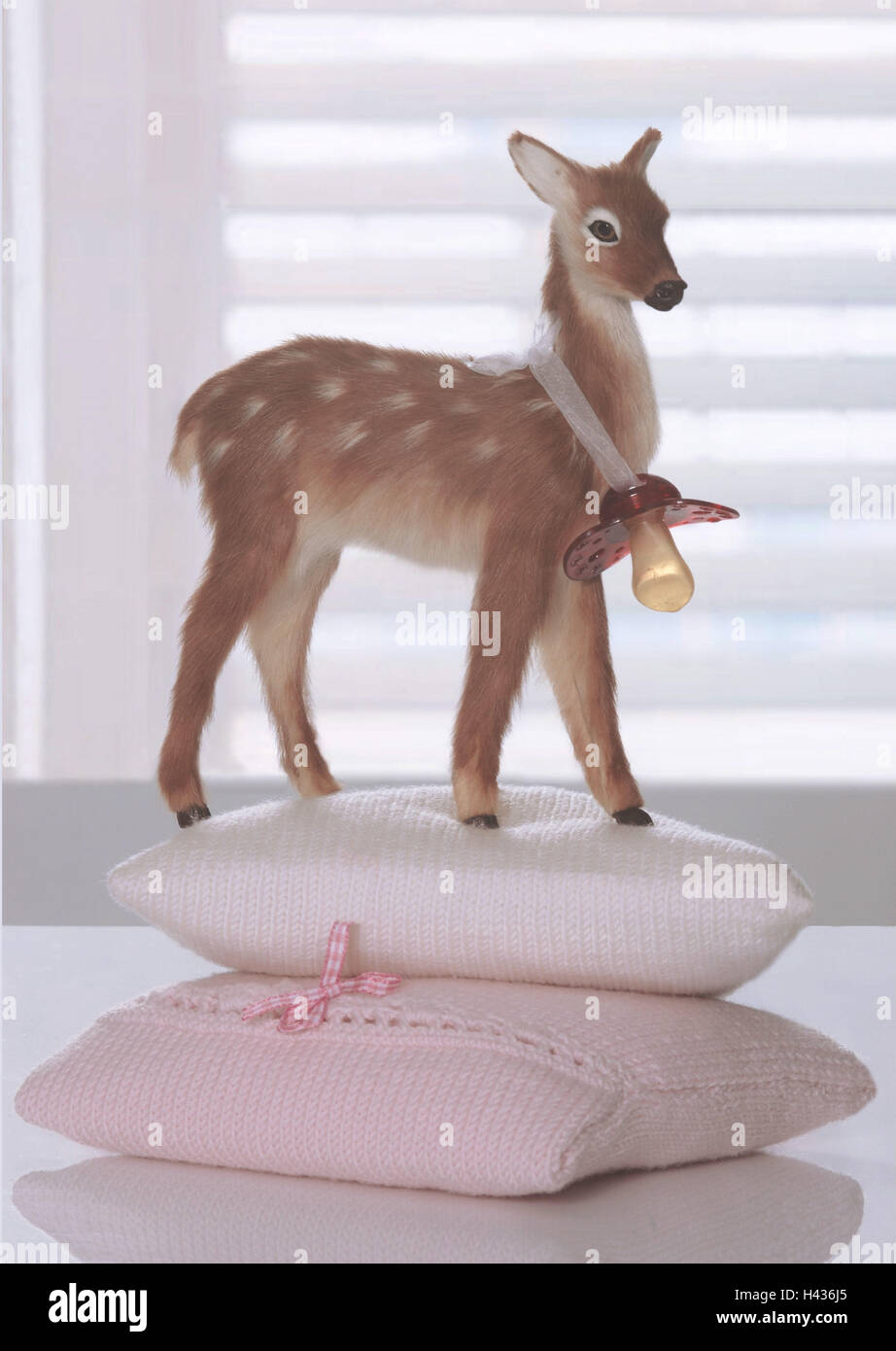 Stilllife, baby utensils, pacifiers, stuffed animal, deer, Stock Photo