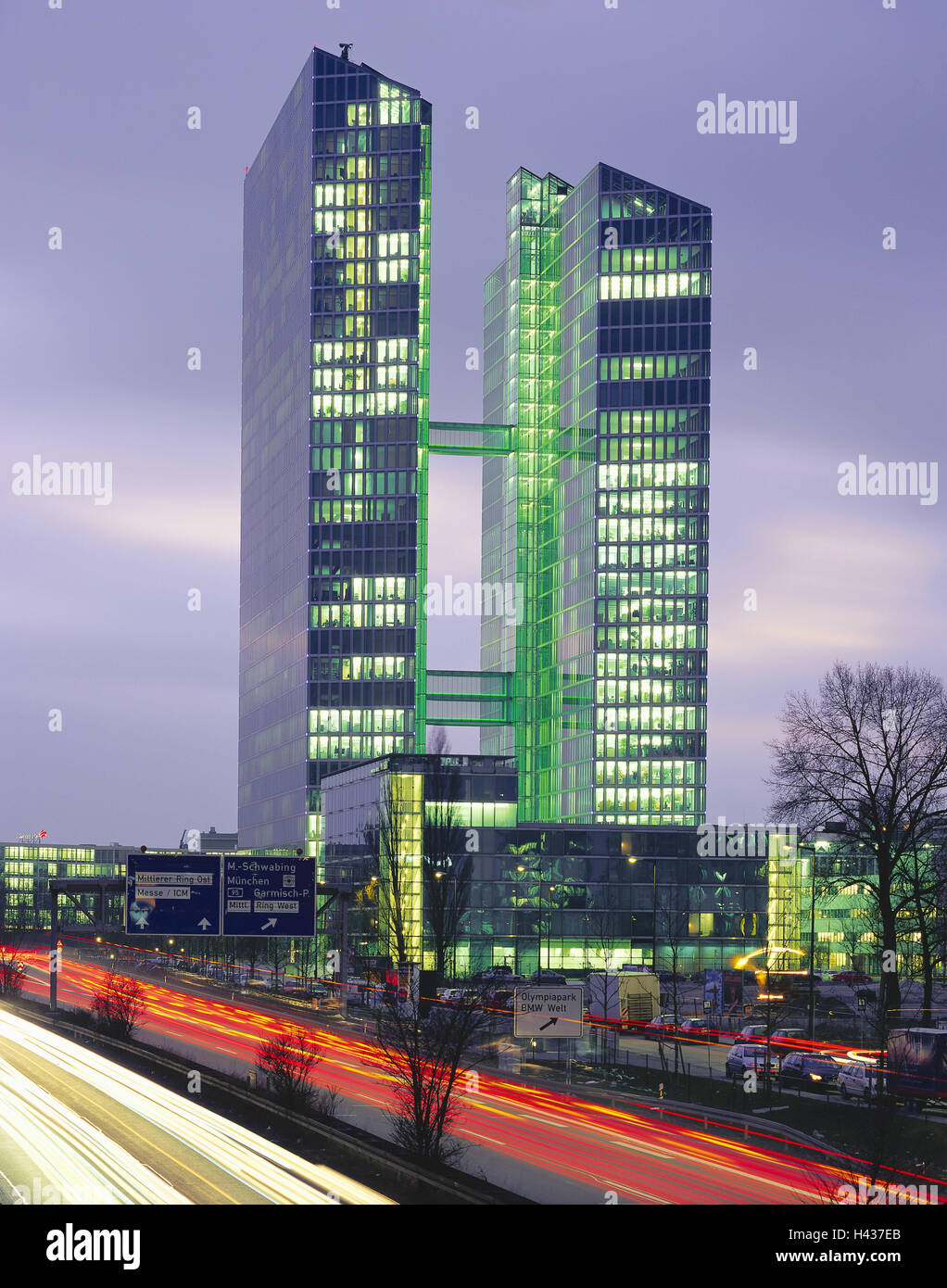 Germany, Bavaria, Munich, 'highlight Tower', highway, light tracks, evening, lighting, Upper Bavaria, München-Schwabing, building, highlight Tower, high rises, high-rise office blocks, office towers, office buildings, architecture, structures, cars, glass front, facade, connection, glass, steel, dusk, lights, red, yellow, Stock Photo