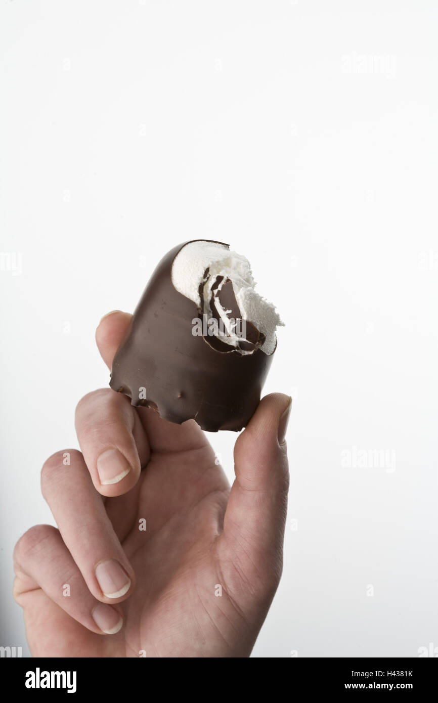 Women's hand, chocolate marshmallow, bitten off, detail, Stock Photo