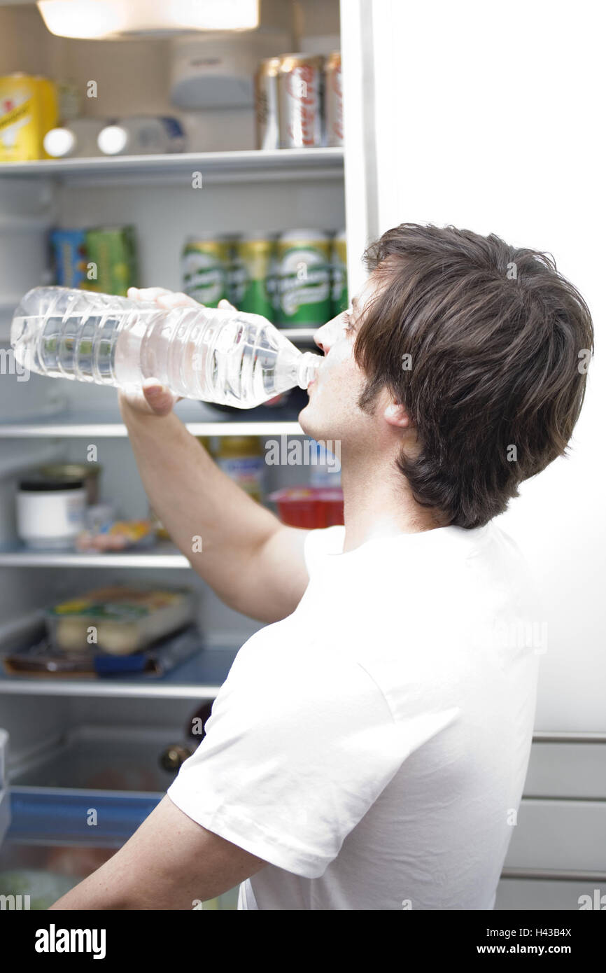 Man, young, fridge, openly, water flask drink, page portrait, person