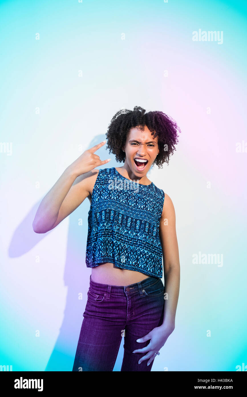 Black woman gesturing with fingers Stock Photo