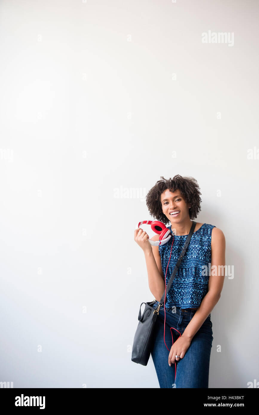 Cheerful Woman Holding Purse Looking At Camera Stock Photo - Download Image  Now - 20-29 Years, 25-29 Years, Adult - iStock