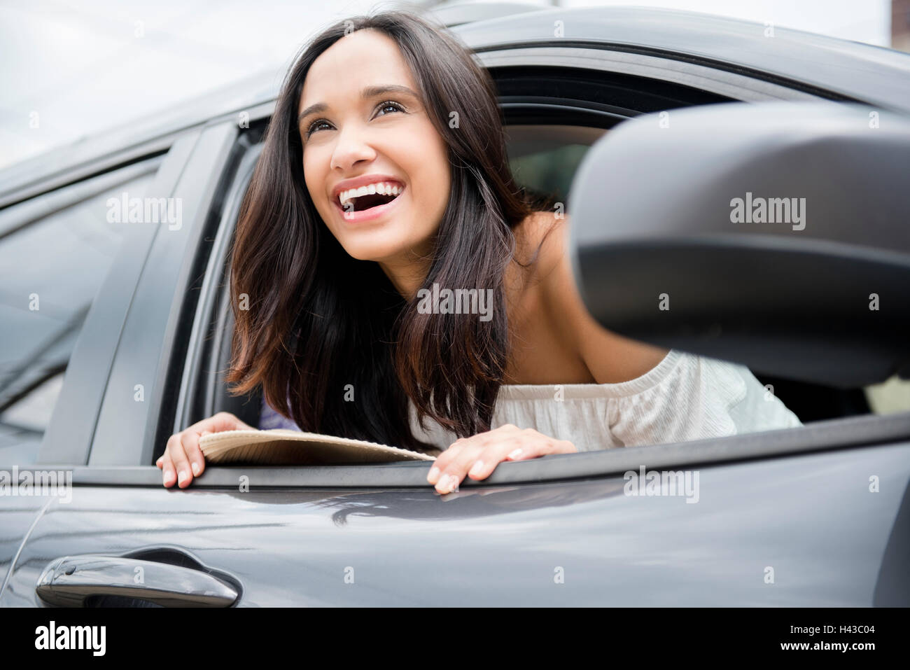 Leaning out of car