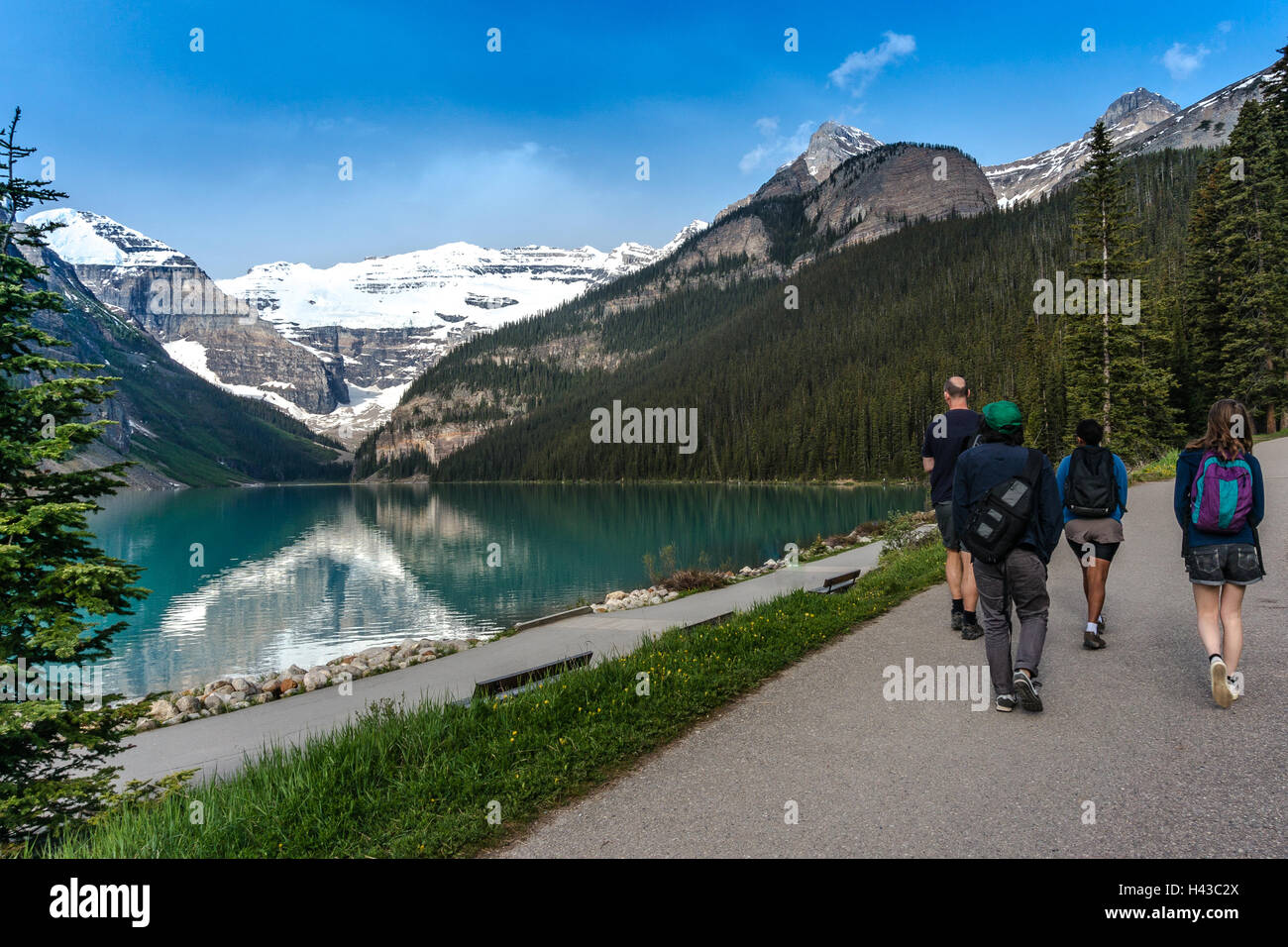 Family hiking by Lake Louise, Banff National Park, Canadian Rockies, Alberta, Canada Stock Photo