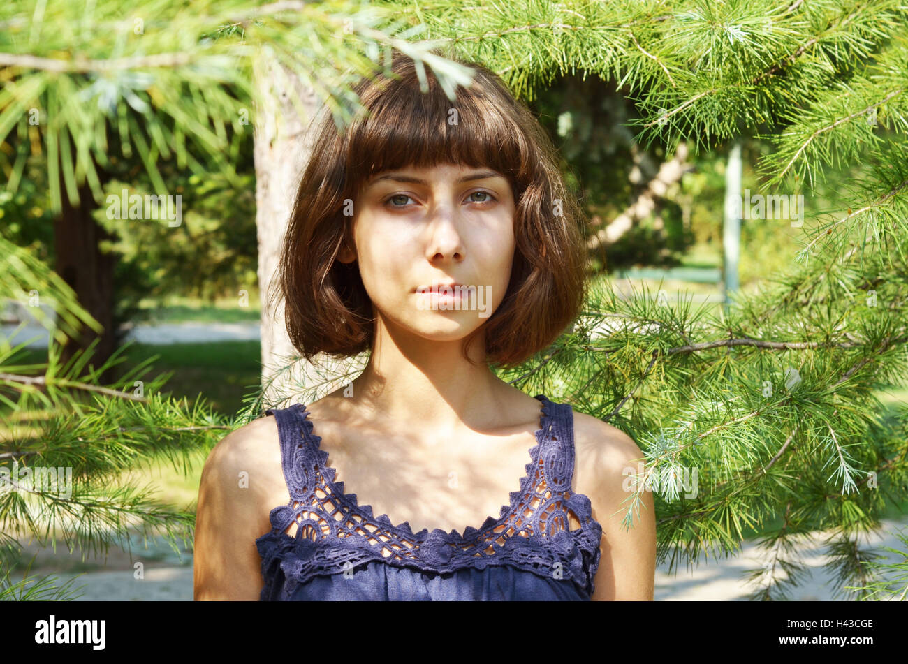 Portrait of a woman in the park Stock Photo - Alamy