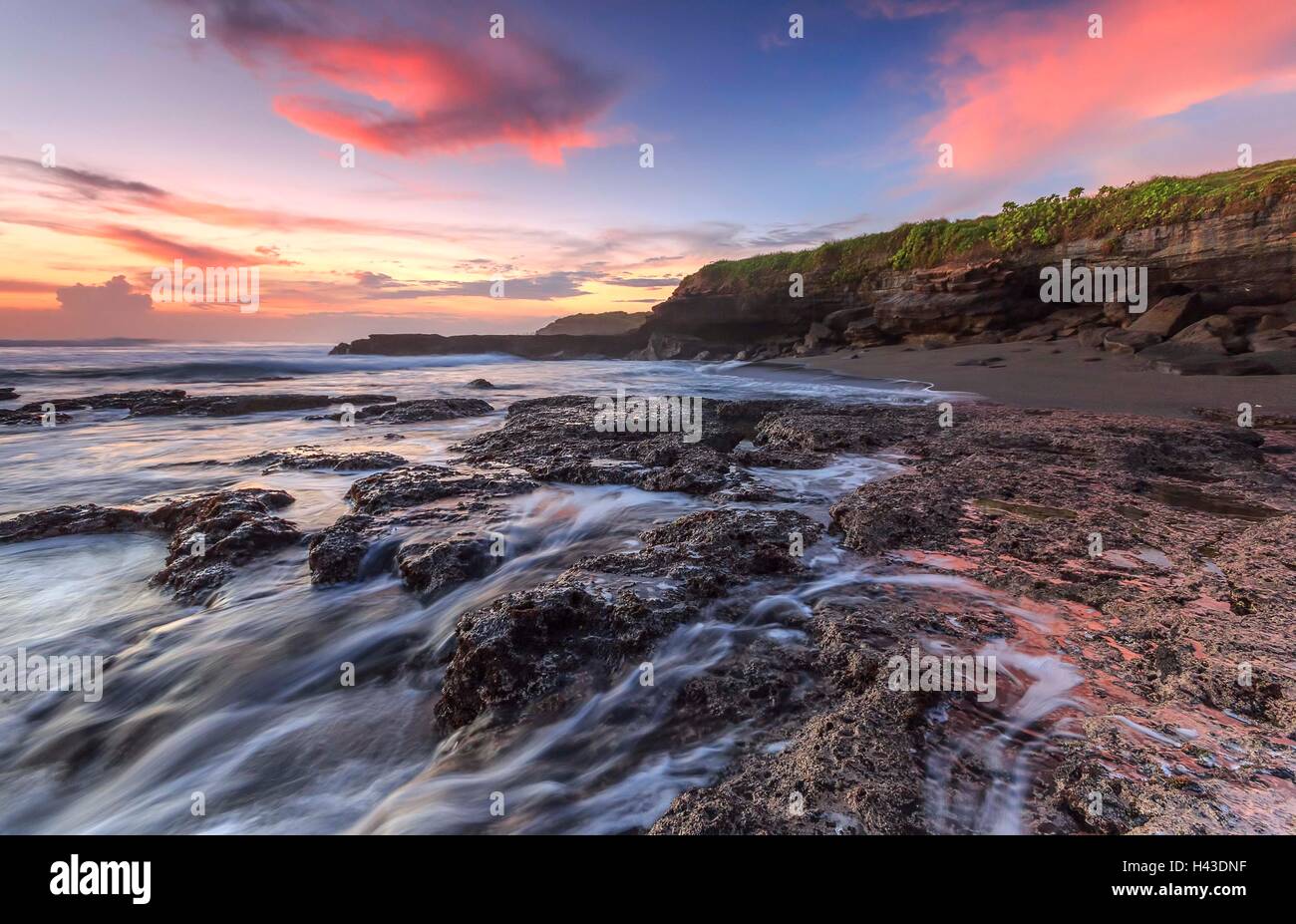 Melasti beach at sunset, Bali, indonesia Stock Photo