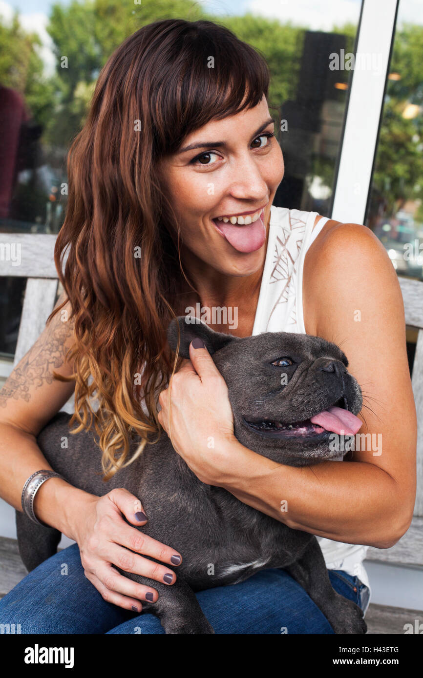 Caucasian woman imitating dog with tongue out Stock Photo