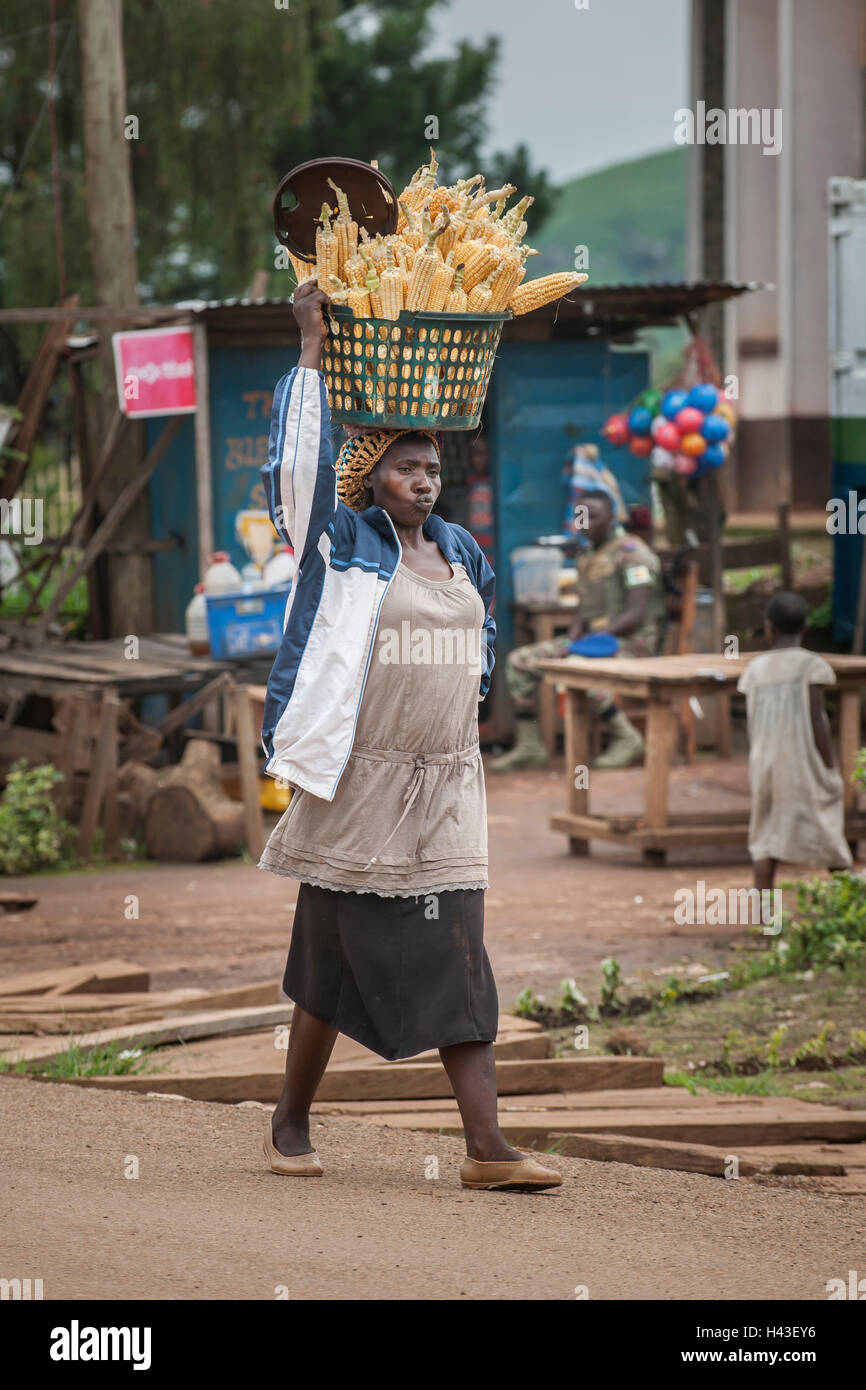 Corn seller on way to market, street scene, Fundong, Northwest Region, Cameroon Stock Photo