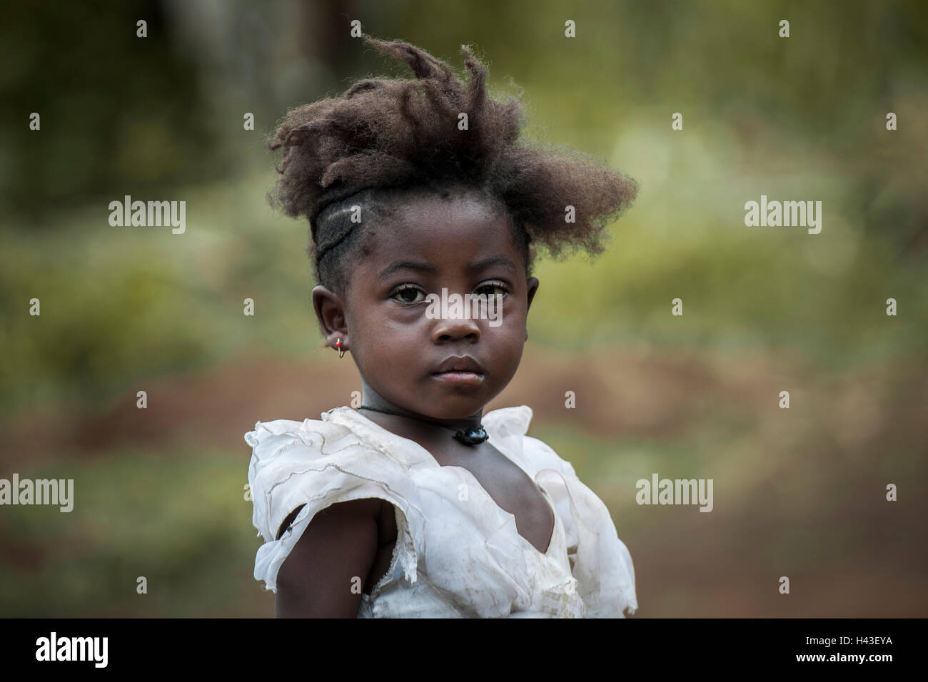 Girl with unique hairstyle, street scene, Fundong, North-West Region, Cameroon Stock Photo