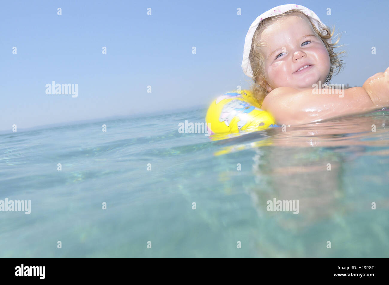 Infant, swimming ring, sea, have of a bath Stock Photo Alamy