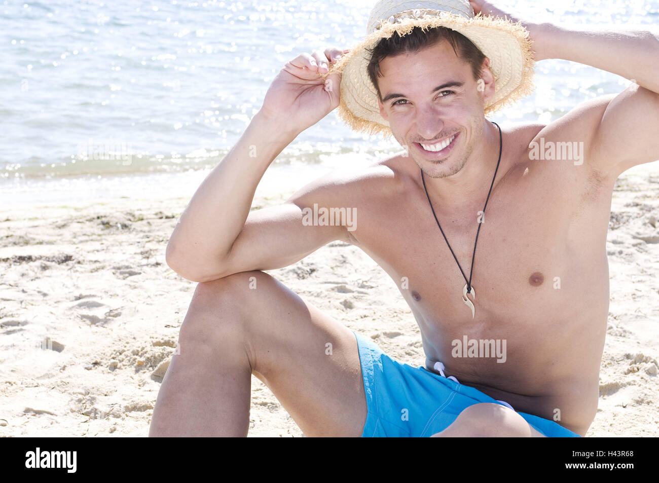 Man, sit young, straw hat, beach, Stock Photo