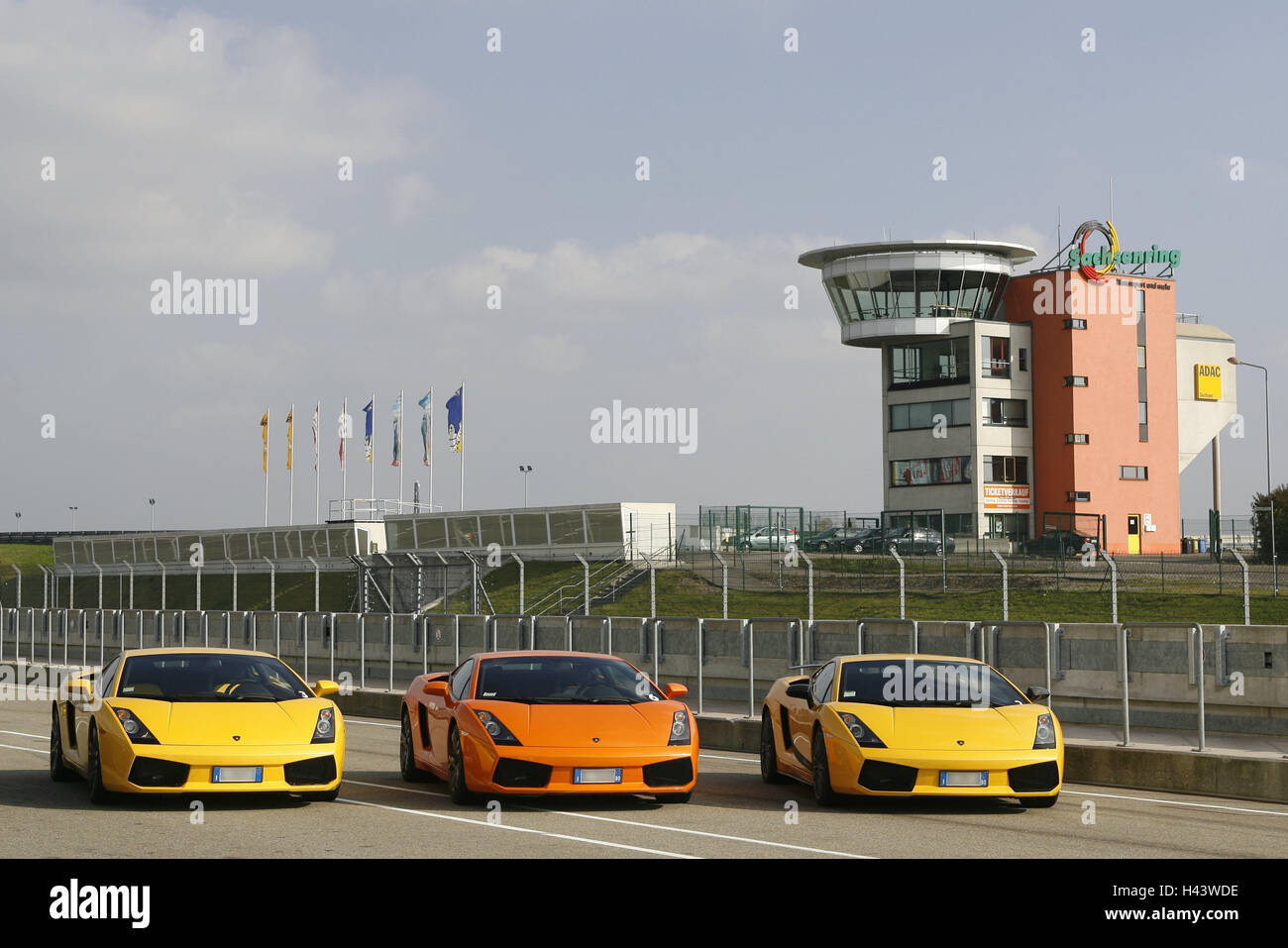 Saxon's ring, race track, Lamborghinis, Germany, 3rd formation, cars, outside, Driving Days, three, Lamborghini, luxury, luxury cars, sports cars, nobly, exclusively, yellow, orange, different colour, stand, side by side, lined up, Stock Photo