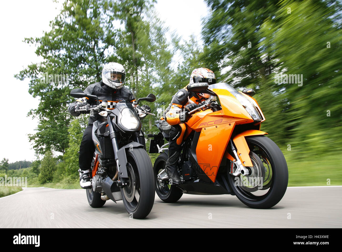 Street, motorcyclist, two, side by side, Stock Photo