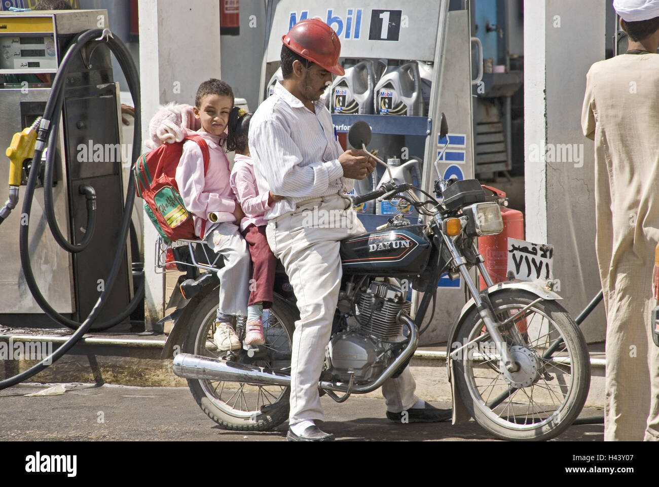 Egypt, Luxor, filling station, man, children, motorcycle, Upper Egypt