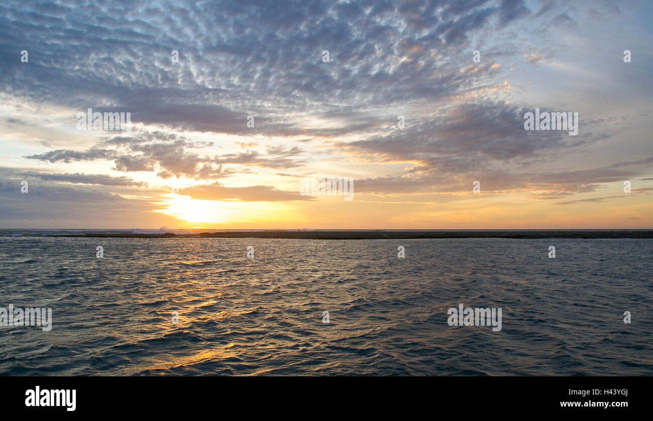 Warm orange glow of a sunset sky over the Murchison River with Indian ...