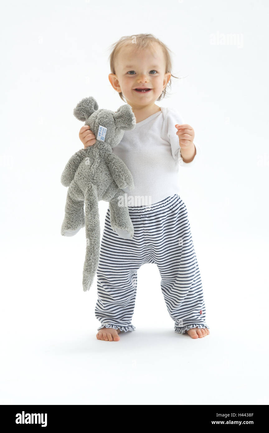 Infant, soft toy, stand, laugh, hold, happy, brightly, child, development, innocence, lighthearted, carefree, nonsense animal, mouse, go, self-confidently, steps, cogs, little cogs, smile, discover actively, curiously, thrilling, expression, operation, mo Stock Photo