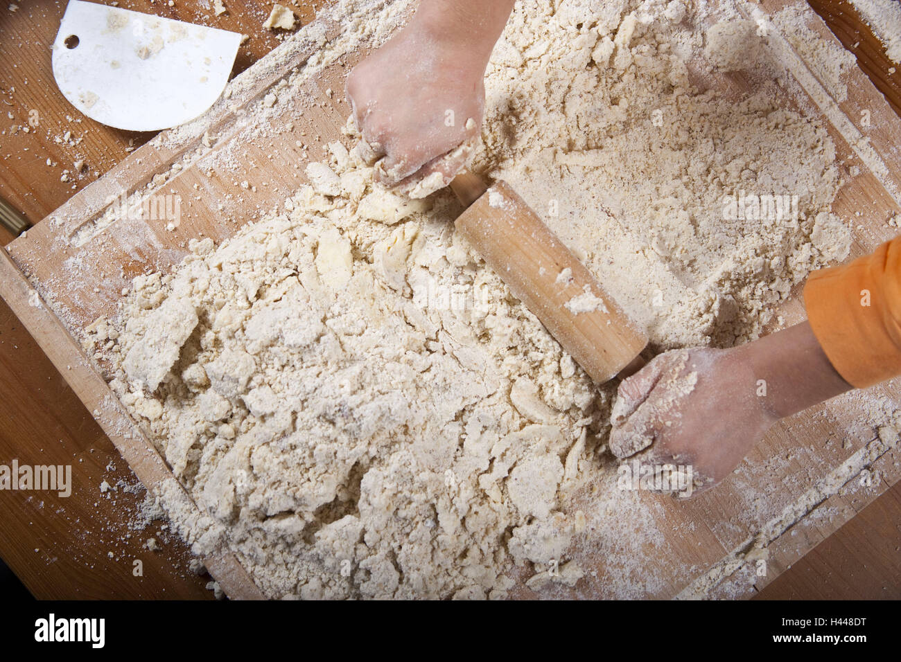 Shoes, dough, roll out, cheek ingredients, shoes, preparation, preparation, flour, sugar, cake dough, dough scooter, wooden scooter, rolling-pin, Christmas, Christmas biscuit, biscuit, cake, mix, raspatory, dough raspatory, Stock Photo