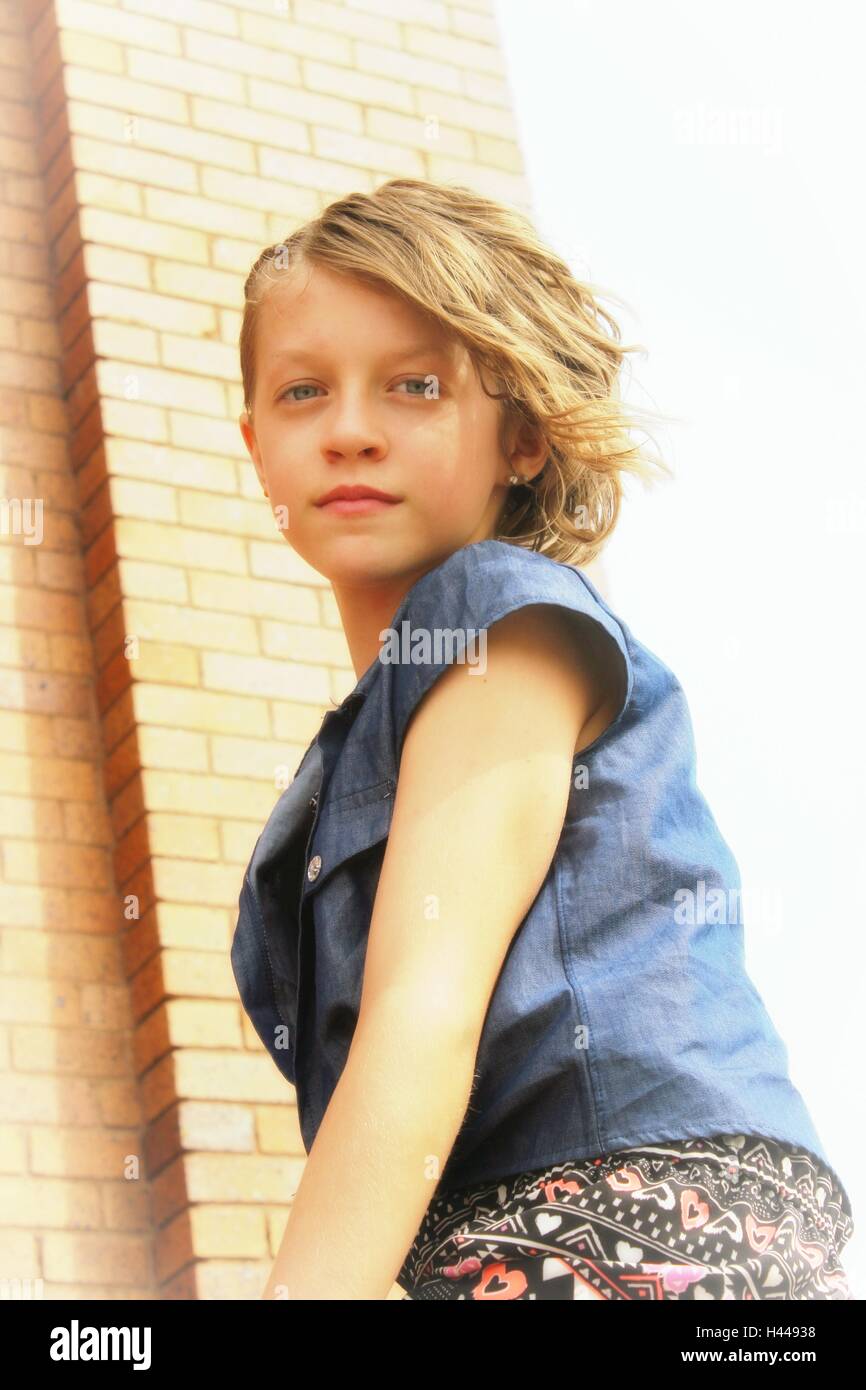 blond hair and blue eyed tween female  in the sun Stock Photo