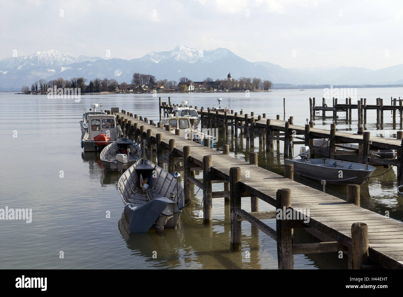Lake Chiemsee, landing stages, boots, water, mirroring, women's island, houses, church, trees, mountains, heavens, clouds, Germany, Bavaria, Chiemgau, Stock Photo