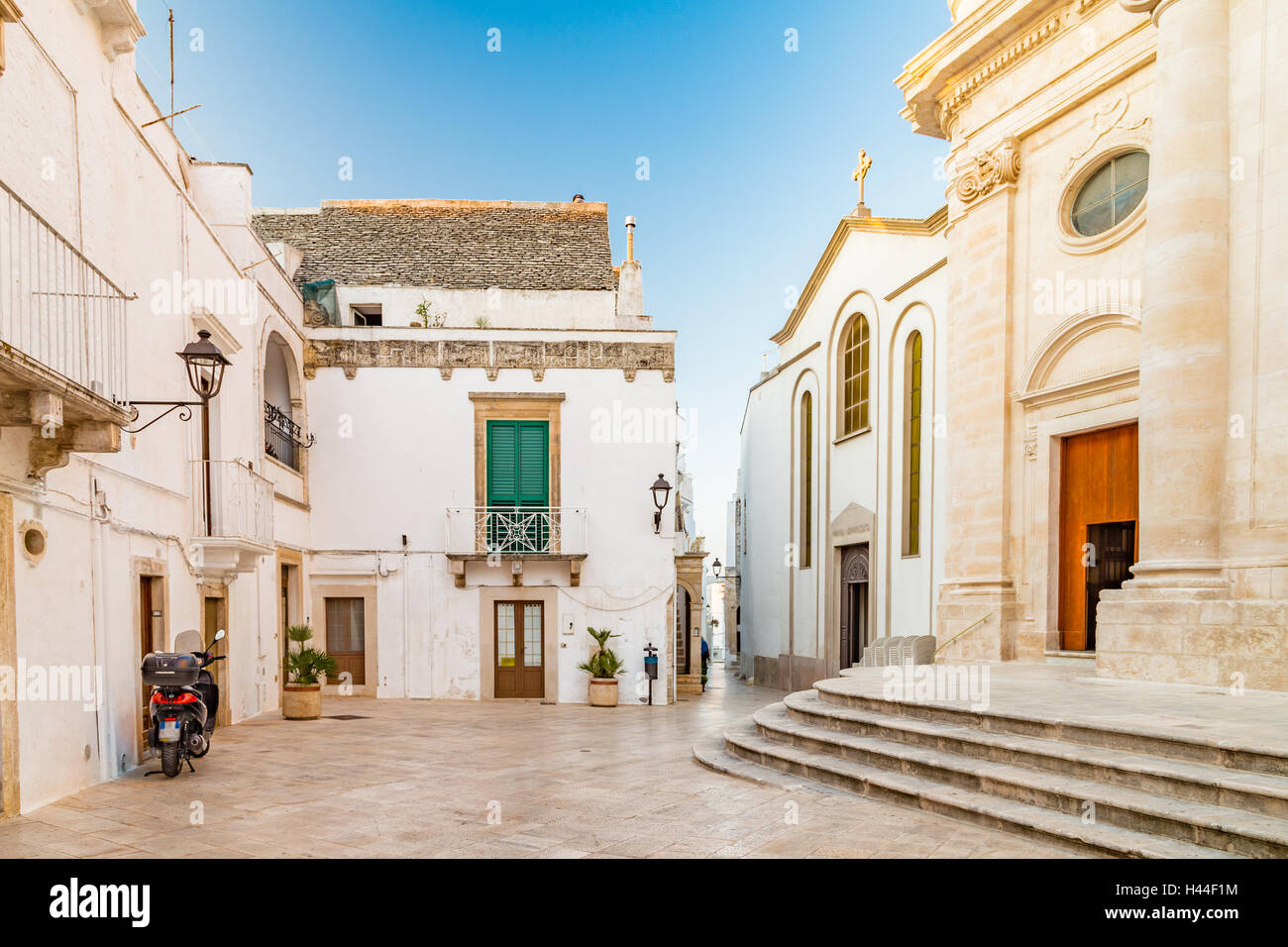 typical Italian square with church in small village in Apulia Stock Photo