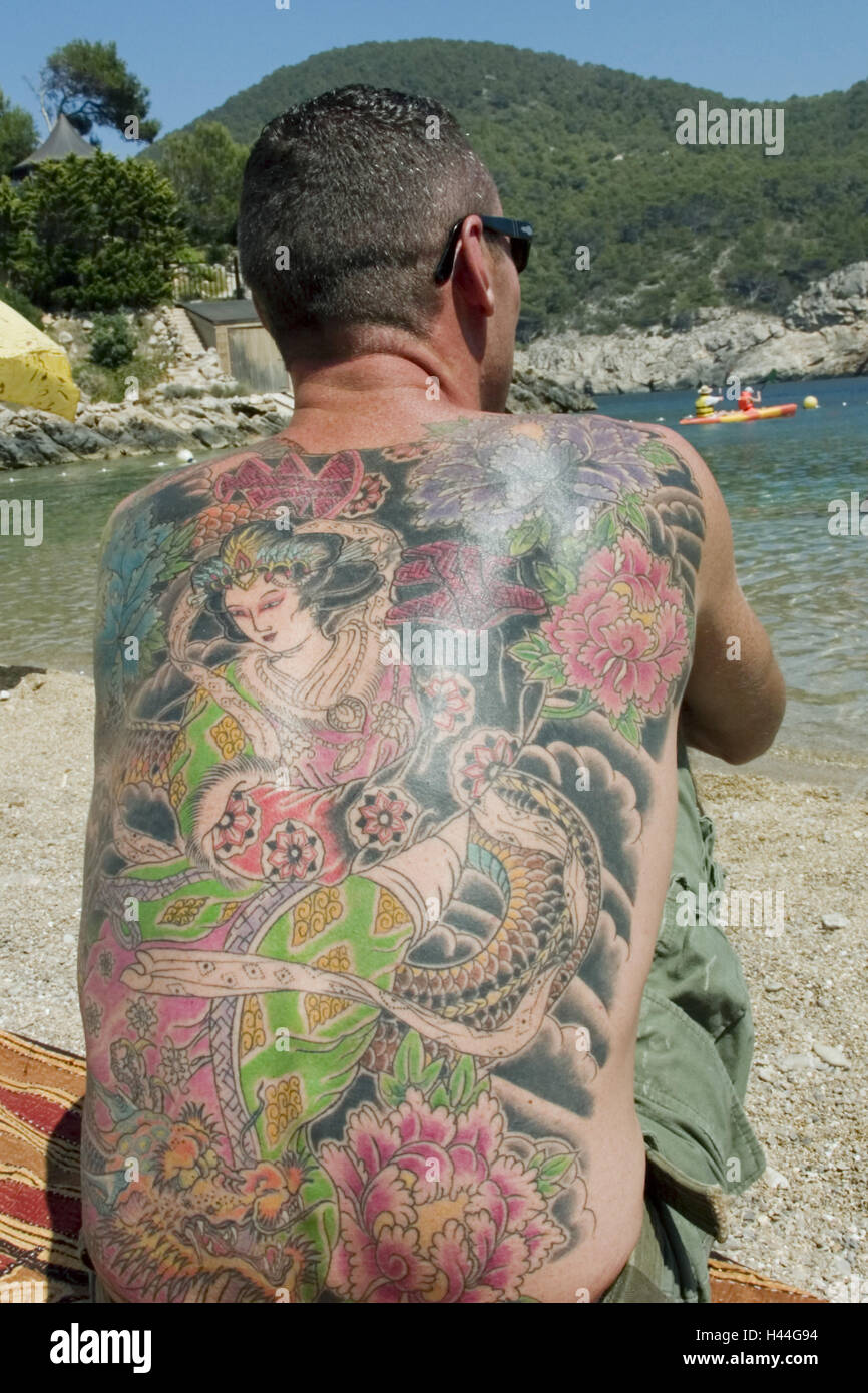 Man, beach, sit, backs, tattoos, back view Stock Photo
