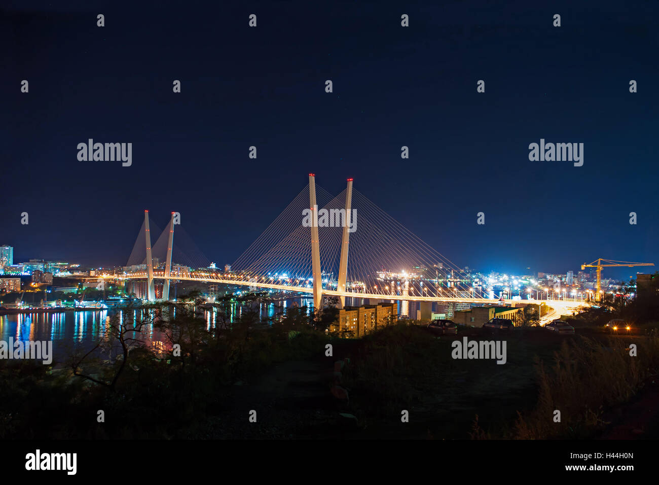 Night view of the bridge in the Russian Vladivostok over the Golden Horn bay. Stock Photo