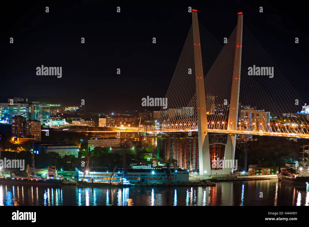 Night view of the bridge in the Russian Vladivostok over the Golden Horn bay. Stock Photo
