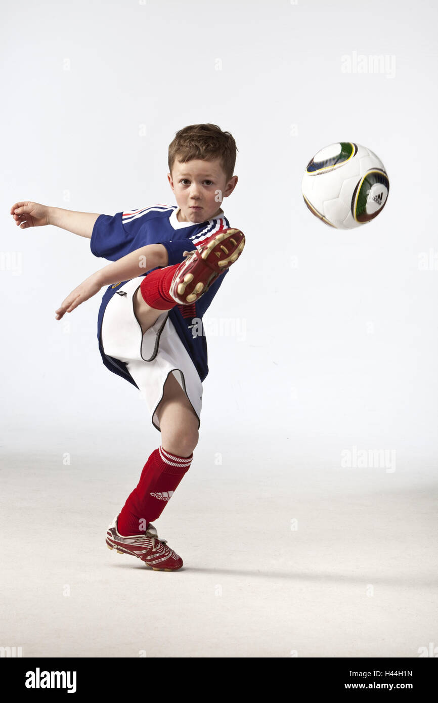 Boy, football, play, motion Stock Photo Alamy