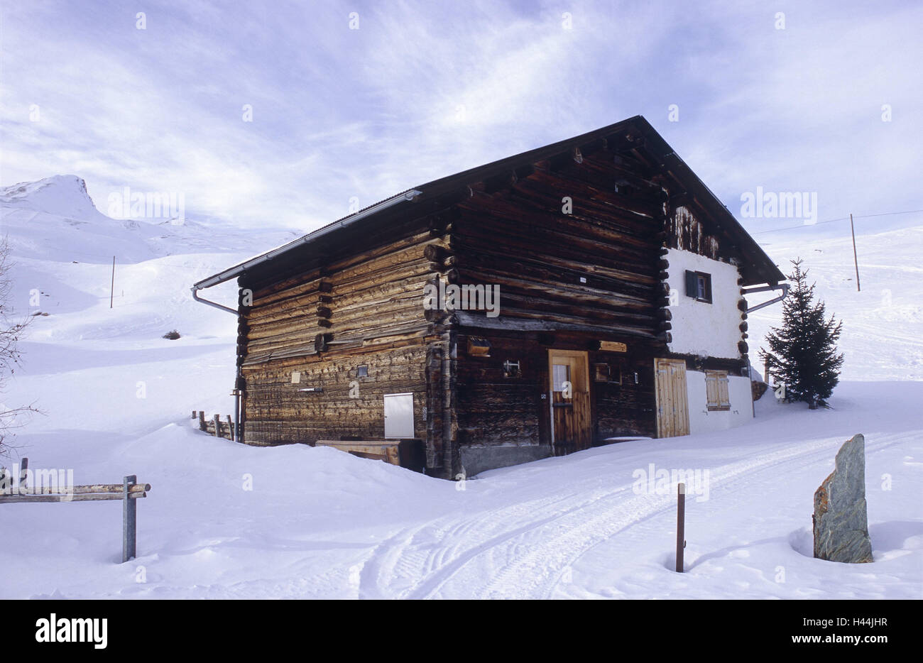 Mountain landscape, farmhouse, winter, lonely, snow, quietly, deposed, coldly, alps, mountain, exit, nobody, winter, house, mountain hut, ski hut, mountain farm, wooden, weather-beaten, track, summit, wooden hut, Hochgebirge, Switzerland, Graubuenden, Sav Stock Photo