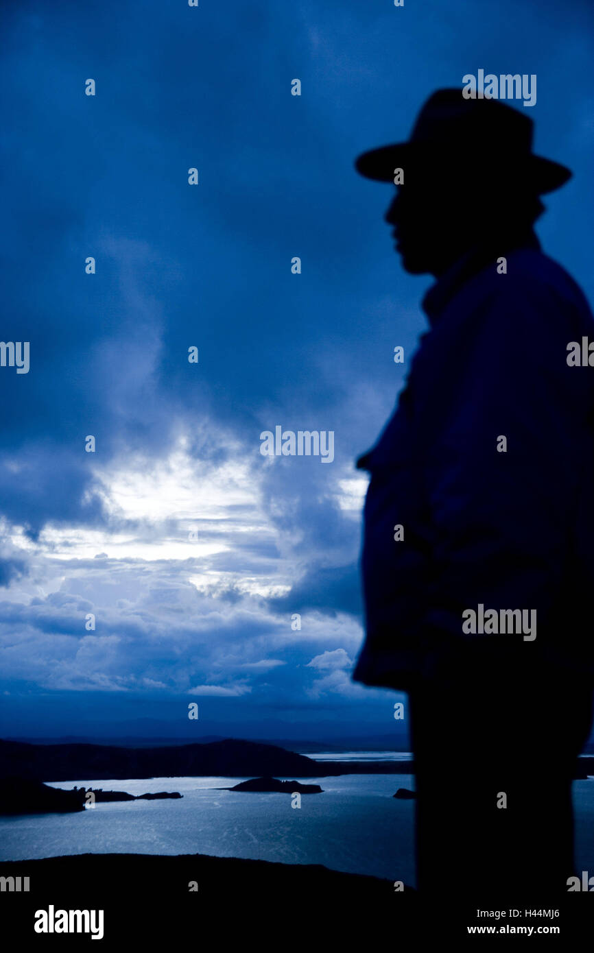 Peru, Amantani, man, side view, silhouette, South America, Bolivia, lake, Titicaca lake, landscape, evening, evening mood, people, native, hat, headdress, sky, clouds, Stock Photo