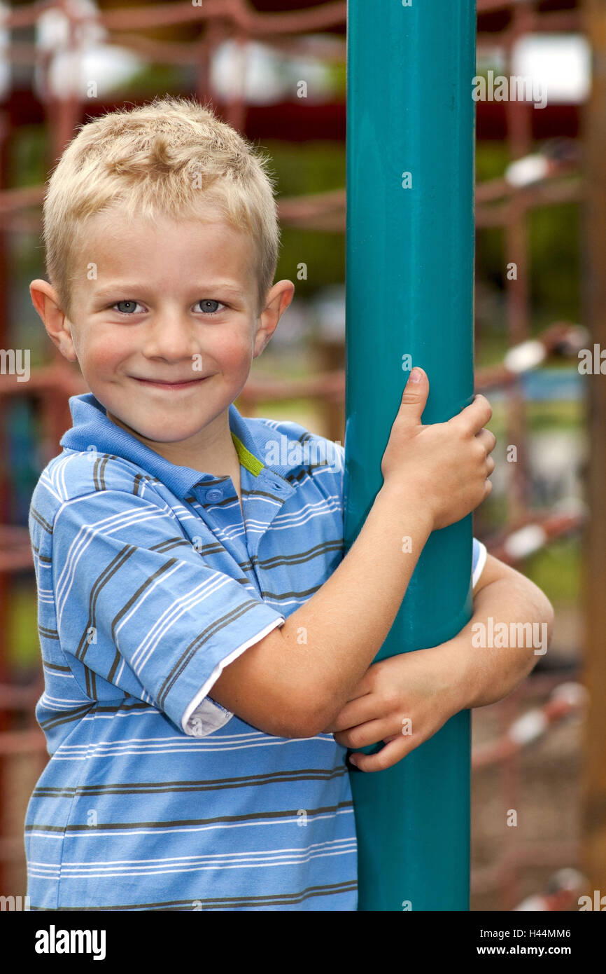 A boy, 5 years old, on a playground, half portrait, model released Stock  Photo - Alamy