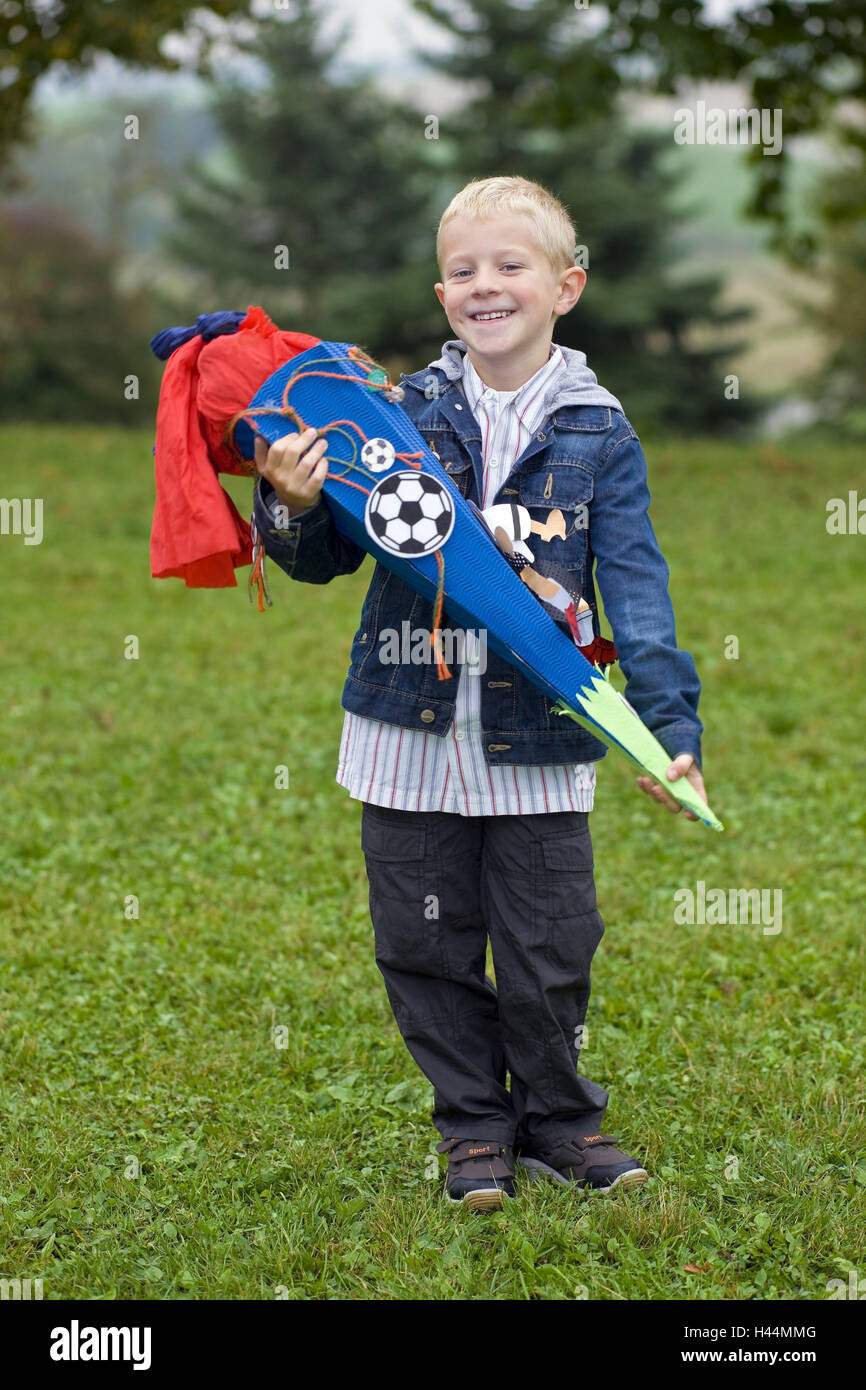 A boy, six years, in the tag his enrolment, with school bag, smile, model released, Stock Photo
