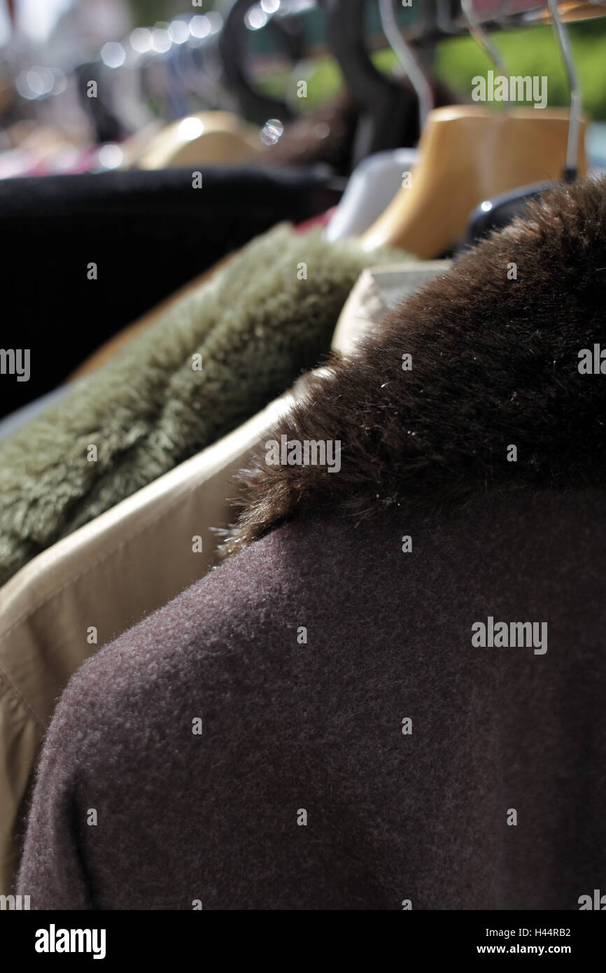 Clothes stand, clothes, casings, medium close-up, detail, flea market, street market, hanger, outside, stand, product, sales, fur collar, fur, collar, the sun, light, uses, fashion, elegantly, sell, many, series, close up, Stock Photo