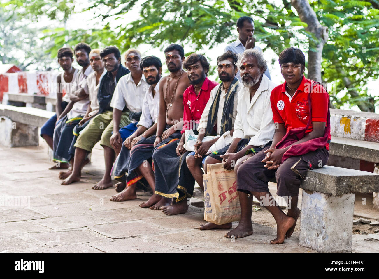 Group Indians on pilgrimage, bank, sit, break, Stock Photo