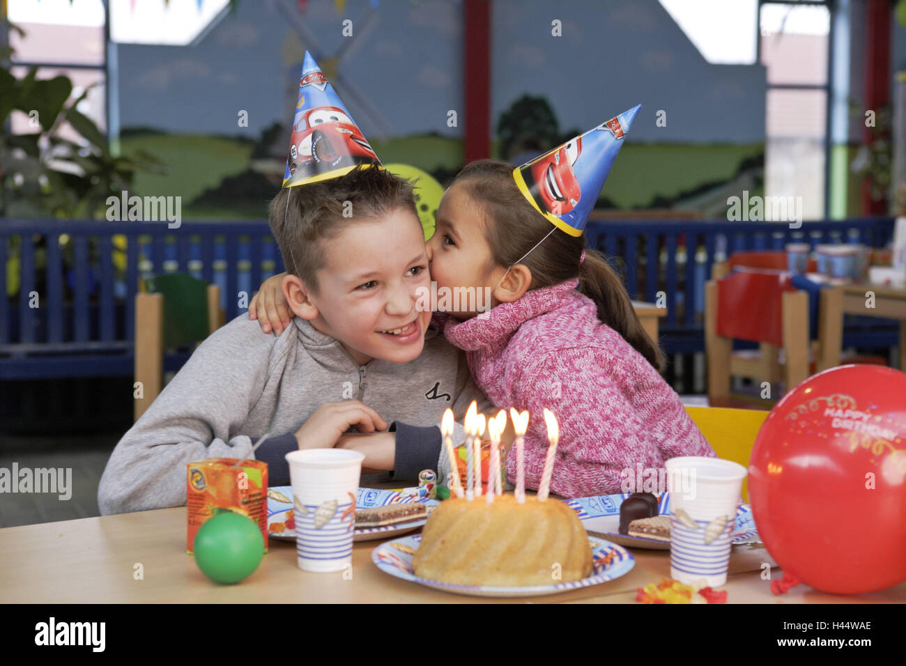 Children's birthday party, boy, girl, paper hats, whisper, cakes